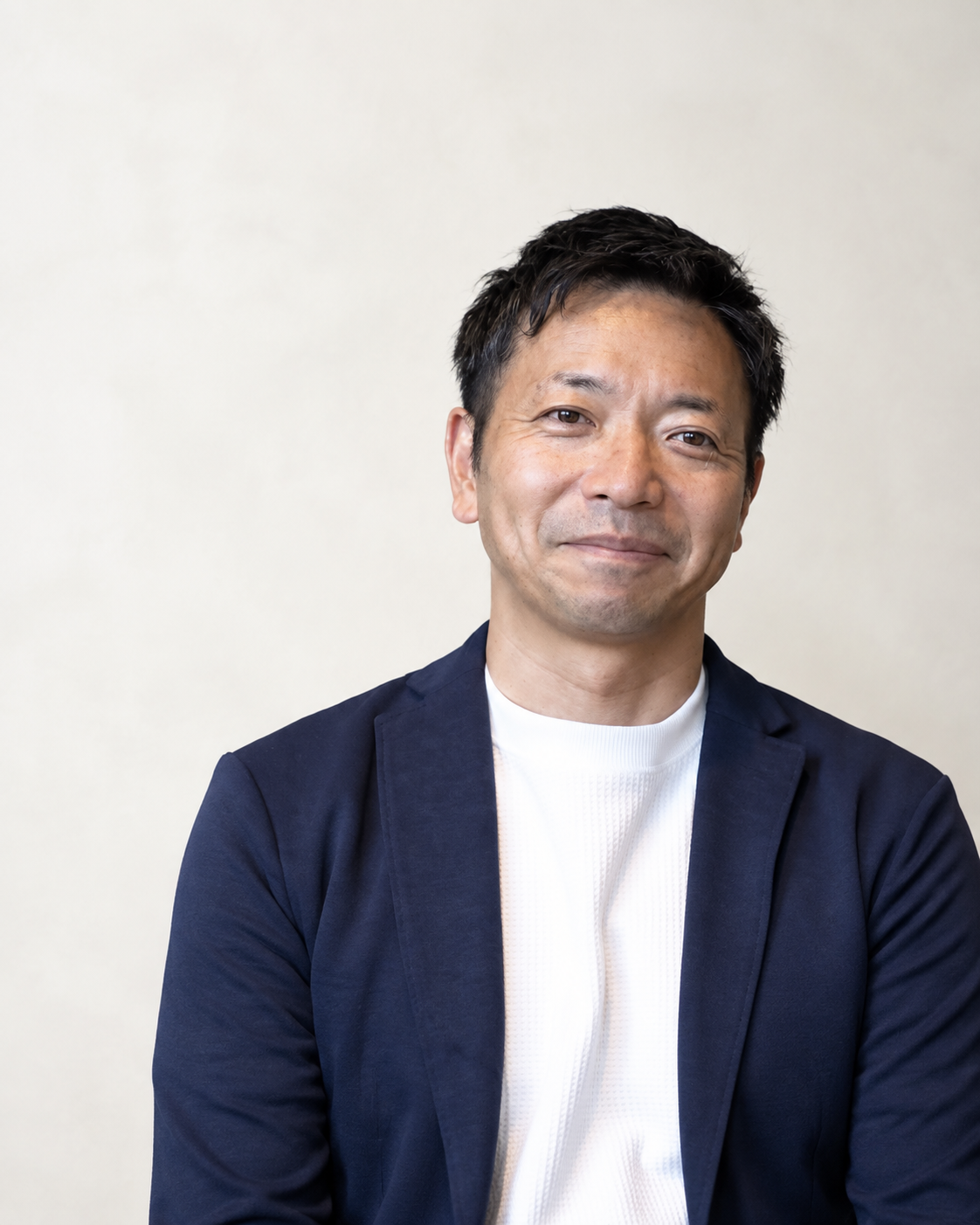 ネイビーのジャケットを着た、株式会社Sports Life Lab 代表取締役 住田優のポートレート